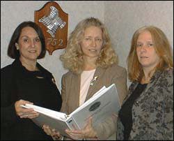 Louise Urbanek (center), flanked by (left) Rose Kibler, HR coordinator, and (right) Jane Zeppuhar, payroll manager, says that background checks are especially important for employees of security companies. Louise Urbanek (center), flanked by (left) Rose Kibler, HR coordinator, and (right) Jane Zeppuhar, payroll manager, says that background checks are especially important for employees of security companies.