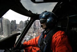 Coast Guard Lt. Rob Donnell flys over Boston, Friday, March 25, 2005. To protect the nation&apos;s coastline from terrorist attacks, the U.S. Department of Homeland Security is dramatically expanding the Coast Guard&apos;s firepower, training and surveillance equip