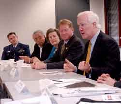 At right, Sen. John Cornyn (R-Texas) meets with other leaders in Beaumont to discuss port security in Texas and what he sees as a system that underfunds security of parts of the nation&apos;s infrastructure.