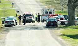 Police surround the scene where a bank robber was killed after a confrontation with a deputy. Police surround the scene where a bank robber was killed after a confrontation with a deputy.