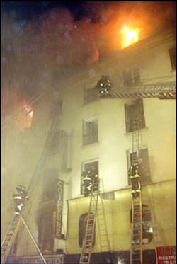 Paris firefighters attempt to save the lives of those trapped in a hotel that caught fire; at least 20 hotel residents are believed dead from the fire. Paris firefighters attempt to save the lives of those trapped in a hotel that caught fire; at least 20 hotel residents are believed dead from the fire.