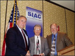 Ron Haner (center) received the inaugural SIAC William N. Moody Award for his volunteer service to the industry from SIAC Executive Director Stan Martin (left) and Director Ron Walters (right). Ron Haner (center) received the inaugural SIAC William N. Moody Award for his volunteer service to the industry from SIAC Executive Director Stan Martin (left) and Director Ron Walters (right).