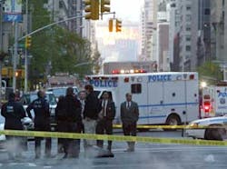 New York City police shut down a portion of Third Avenue in Manhattan as they investigate an explosion in front of the building which houses the British Consulate in New York, Thursday, May 5, 2005. Two small makeshift grenades exploded outside the Britis