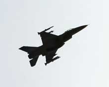 An F-16 fighter jet, fully armed with air-to-air missiles under its wings, maneuvers above the northwest section of Washington D.C., Wednesday, May 11, 2005, near a cluster of embassies from Middle Eastern nations as it and at least one other F-16 scrambl