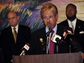 (left) Dr. Cecil Burge, Southern Miss vice president for research and economic development, and (right) Darryl Neely, policy advisor to Mississippi Gov. Haley Barbour, listens to Ed Harrington, director of the Mississippi Office of Homeland Security, as h