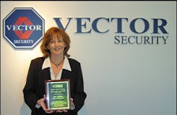 Pat Killian, false alarm reduction program manager for Vector Security, shows off the award she recently received fromt eh False Alarm Reduction Association (FARA). Pat Killian, false alarm reduction program manager for Vector Security, shows off the award she recently received fromt eh False Alarm Reduction Association (FARA).