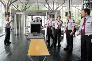 Security guards stand wait for the official opening of Oslo's famed Munch Museum, Friday, June 17, 2005. The museum was to reopen with massive security upgrades brought on by the brazen theft of two Edvard Munch masterpieces, 'The Scream' and 'Madonna' by