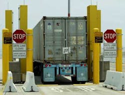 A truck passes through a radiation portal monitor Wednesday, July 20, 2005, at the Port of Los Angeles. U.S. Customs and Border Protection commissioner Robert C. Bonner visited the area Wednesday and gave a briefing on homeland security measures.