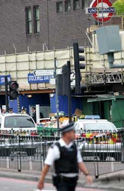 Police officers stand guard outside Stockwell Underground station in south London, Friday July 22, 2005, where a man who police believed to involved in terrorist incidents, was reported to have been shot. Police officers stand guard outside Stockwell Underground station in south London, Friday July 22, 2005, where a man who police believed to involved in terrorist incidents, was reported to have been shot.
