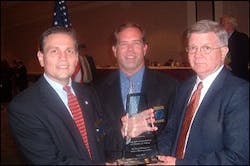 Chief Dekmar (left) and Chief Cotton (center) accept the award from SIAC law enforcement liaison Glen Mowrey. Chief Dekmar (left) and Chief Cotton (center) accept the award from SIAC law enforcement liaison Glen Mowrey.