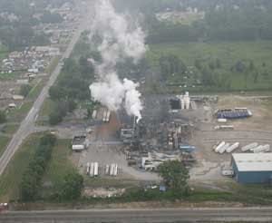 The E.Q. Resource Recovery Inc. plant in Romulus, Mich, is seen Wednesday, August 10, 2005. Hundreds of people were advised to stay away from their homes as a fire at a suburban Detroit chemical plant sent acrid smoke over their neighborhoods. At least 32