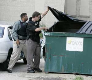 Pontiac (Mich.) police check the area around the 50th District Court after four prisoners escaped from the courthouse Monday, Aug. 15, 2005, in Pontiac, Mich., after one of the men overpowered a security guard. All four inmates were later recaptured.
