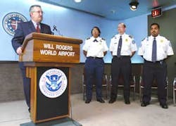 Larry Kettler, Transportation Security Administration Federal Security Director at Will Rogers World Airport in Oklahoma City, honors three Will Rogers World Airport screeners on Wednesday, Aug. 17, 2005. Flossie Ridley, Doug Bentley, and Victor Kunnath, Larry Kettler, Transportation Security Administration Federal Security Director at Will Rogers World Airport in Oklahoma City, honors three Will Rogers World Airport screeners on Wednesday, Aug. 17, 2005. Flossie Ridley, Doug Bentley, and Victor Kunnath,