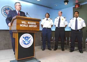 Larry Kettler, Transportation Security Administration Federal Security Director at Will Rogers World Airport in Oklahoma City, honors three Will Rogers World Airport screeners on Wednesday, Aug. 17, 2005. Flossie Ridley, Doug Bentley, and Victor Kunnath,