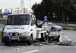 A badly damaged armored security vehicle in Stockholm, Monday, Aug. 29, 2005 after at least three masked gunmen used explosives to break into it. Armed with automatic weapons, the three robbers forced guards out of the car before detonating explosives to