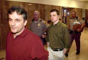 Wade Lay, 44, left and his son, Christopher Lay, 20, enter court in Tulsa, Okla., Sept. 22, 2005. The two were convicted Monday, Sept. 26, 2005, of murdering a bank security guard during an attempted robbery. The bank guard, Kenneth Anderson, 36, was kill