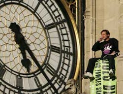 A protester, named by pressure group Fathers 4 Justice as Guy Harrison, unfurls a banner which reads 'Does Blair Care' after he climbed onto the roof of the Houses of Parliament in London on Tuesday, Sept. 27, 2005. Several police officers stood nearby, o A protester, named by pressure group Fathers 4 Justice as Guy Harrison, unfurls a banner which reads 'Does Blair Care' after he climbed onto the roof of the Houses of Parliament in London on Tuesday, Sept. 27, 2005. Several police officers stood nearby, o