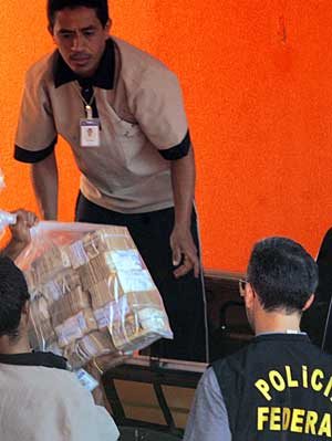 Brazilian police load money on a truck at a home in Fortaleza, northern Brazil, Wednesday, Sept. 28, 2005. The money, about US$4.3 million (3.6 million), was recovered by police of the US$70 million (58 million) stolen last month in a heist from Brazil's