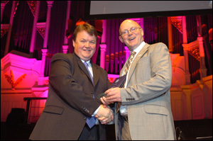 Antony Elliott (left), president of ASIAL, presents the award for Best New Product to Chris Boyce, commercial director, Dedicated Micros.