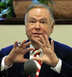 University of Oklahoma President David Boren gestures as he answers a question at a news conference in Norman, Okla., on Tuesday, concerning security measures at Memorial Stadium.