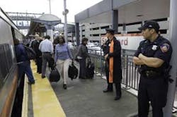 Police monitor the Stamford, Conn., train tracks that service Amtrak and Metro-North, Friday Oct. 7, 2005. Gov. M. Jodi Rell on Thursday night ordered increased security on Metro-North trains because of what New York City officials called a credible threa Police monitor the Stamford, Conn., train tracks that service Amtrak and Metro-North, Friday Oct. 7, 2005. Gov. M. Jodi Rell on Thursday night ordered increased security on Metro-North trains because of what New York City officials called a credible threa