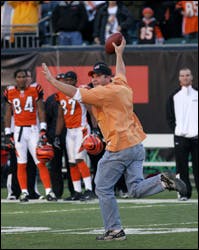 The Bengals are reexamining what it takes to secure a stadium after a fan ran onto the field of a NFL game and snatched the ball from Packer&apos;s quarterback Brett Favre.