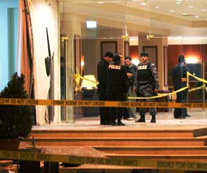 Jordanian security forces stand guard in front of the main gate of Radisson Hotel in Amman after an explosion believed to have killed at least five people and wounded 20 others, Wednesday Nov. 9 2005. Explosions rocked three hotels in the Jordanian capita