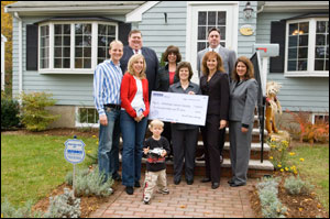 Front Row, from left to right: Millionth Brink's customers: The Stolarz family (Mr. and Mrs. E. Stolarz and son); American Cancer Society representative Jean Martinho, Vice President for Planned Giving; Carole Vanyo, Brink's Sr. Vice President, Customer