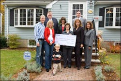Front Row, from left to right: Millionth Brink's customers: The Stolarz family (Mr. and Mrs. E. Stolarz and son); American Cancer Society representative Jean Martinho, Vice President for Planned Giving; Carole Vanyo, Brink's Sr. Vice President, Customer Front Row, from left to right: Millionth Brink's customers: The Stolarz family (Mr. and Mrs. E. Stolarz and son); American Cancer Society representative Jean Martinho, Vice President for Planned Giving; Carole Vanyo, Brink's Sr. Vice President, Customer