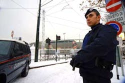 An Italian Carabinieri paramilitary police officer stands guard in front of Turin's Olympic stadium, one of the venues where the Feb. 10-26 2006 Winter Olympic games will be held, Friday, Jan. 27, 2006. During a briefing Italian Interior Ministry official An Italian Carabinieri paramilitary police officer stands guard in front of Turin's Olympic stadium, one of the venues where the Feb. 10-26 2006 Winter Olympic games will be held, Friday, Jan. 27, 2006. During a briefing Italian Interior Ministry official