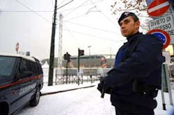 An Italian Carabinieri paramilitary police officer stands guard in front of Turin&apos;s Olympic stadium, one of the venues where the Feb. 10-26 2006 Winter Olympic games will be held, Friday, Jan. 27, 2006. During a briefing Italian Interior Ministry official