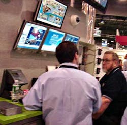 Demonstrating SAI&apos;s IP-networked access control system at the DVTel booth during ISC West