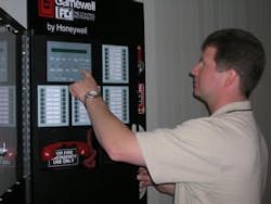 Paul Melcher, sales engineer for IQ Life Safety Systems of Holly, Mich., programs one of Gamewell-FCI&Acirc;&rsquo;s E3 Series fire alarm control panels.