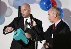 John Dowd, left, and Dennis Koehler, right, of Isonics Corporation demonstrate the company's new handheld IMS detection unit to an audience of law enforcement and homeland security on Wednesday, Aug. 2, 2006, at the PartnerTech manufacturing facility in D John Dowd, left, and Dennis Koehler, right, of Isonics Corporation demonstrate the company's new handheld IMS detection unit to an audience of law enforcement and homeland security on Wednesday, Aug. 2, 2006, at the PartnerTech manufacturing facility in D