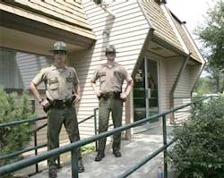 EAST THETFORD VT USA -- Vermont state troopers stand at the entrance to the Merchants Bank in East Thetford, Vt., Wednesday, Aug. 2, 2006. A two-hour hostage standoff involving an apparent bank robber and two bank employees ended peacefully Wednesday with EAST THETFORD VT USA -- Vermont state troopers stand at the entrance to the Merchants Bank in East Thetford, Vt., Wednesday, Aug. 2, 2006. A two-hour hostage standoff involving an apparent bank robber and two bank employees ended peacefully Wednesday with