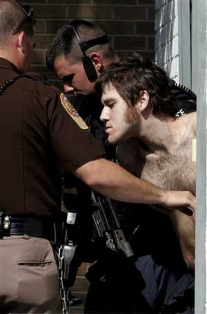 CHRISTIANSBURG VA USA -- Escaped inmate William Morva, is escorted out of the Montgomery County magistrate's office Monday, Aug. 21, 2006, in Christiansburg, Va. After a massive manhunt that shut down the Virginia Tech campus in Blacksburg, Va., on the fi