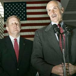 Homeland Security Secretary Michael Chertoff speaks as Transportation Security Administration Assistant Secretary Kip Hawley listens, left, during a news conference at Logan International Airport in Boston, Thursday, Sept. 14, 2006, where he announced tha