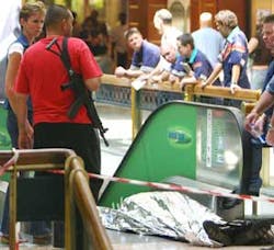 An robber lays dead after alledgedly being shot by a a private security guard during a cash delivery robbery in a shopping center in Johannesburg Monday. Sept. 25 2006. In an annual report released by the police in Pretoria, South Africa, Wednesday Sept An robber lays dead after alledgedly being shot by a a private security guard during a cash delivery robbery in a shopping center in Johannesburg Monday. Sept. 25 2006. In an annual report released by the police in Pretoria, South Africa, Wednesday Sept