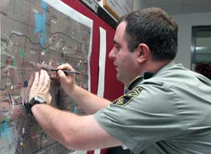 Part of a military exercise called 'Eternity' with soldiers from three neighboring countries, Azerbaijan, Georgia and Turkey, Lt. Col. David Rukhadze from Georgia works on an intelligence situation map in Ankara, Turkey, Friday, Sept. 29, 2006. The exerci