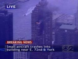 This image from television shows fire and smoke after a small plane crashed into a high-rise on Manhattan&apos;s Upper East Side, police said Wednesday Oct. 11, 2006.