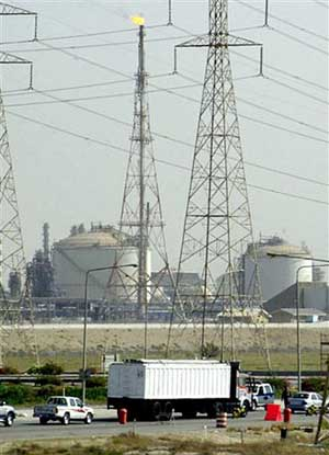 Police stop vehicles at a checkpoint near an oil refinery in Jubail, Saudi Arabia, in this June 1, 2004 file photo. Police have arrested 172 Islamic militants, some of whom were being trained abroad as pilots so they could fly aircraft in attacks on Saudi