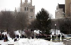 Under the spires of Altgeld Hall, Northern Illinois University community members gathered near Cole Hall after word of the campus shooting spread through the university Thursday Feb. 14, 2008. A man opened fire with a shotgun and a handgun wounding severa Under the spires of Altgeld Hall, Northern Illinois University community members gathered near Cole Hall after word of the campus shooting spread through the university Thursday Feb. 14, 2008. A man opened fire with a shotgun and a handgun wounding severa