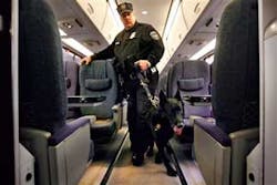 Amtrak police officer Joe Zawacki demonstrates a search for explosives with a dog on an Amtrak train as part of a demonstration of new security sweeps at Union Station in Washington on Friday, Feb. 15, 2008. Amtrak passengers will have to submit their car Amtrak police officer Joe Zawacki demonstrates a search for explosives with a dog on an Amtrak train as part of a demonstration of new security sweeps at Union Station in Washington on Friday, Feb. 15, 2008. Amtrak passengers will have to submit their car
