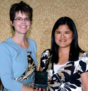 Zanoe Jalomo (right) accepts the award for Outstanding Customer Service Team at PSA-TEC 2008.