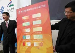 In this April 23, 2008 file photo, officials from the Beijing Organizing Committee for the Olympic Games unveil the design for tickets for the 2008 Olympic Games in Beijing. In a move unprecedented for the Olympics, tickets for both the opening and closin