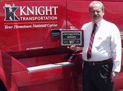 Knight Transportation corporate director of security Richard Martin with his award from the Security Council of the American Trucking Association for Security Professional of the Year. Since Martin&apos;s arrival at Knight, the amount of cargo thefts suffered