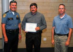 Seattle Police Chief Gil Kerlikowske presents service award to RAE Systems Regional Sales Manager Lloyd Stading with Seattle Police Department CBRNE Hazardous Materials Officer Tim Allen