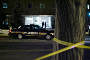 Police and officials gather outside the lobby of the Donaldson Brown Graduate Life Center at Virginia Tech in Blacksburg, Va. Wednesday night Jan. 21, 2009. A female student was stabbed to death on Virginia Tech's campus, the first killing at the school s