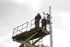 Champions and Data Consultants staff discuss the installation of intelligent security cameras to assist the ferry business on Harsens Island, northeast of Detriot.