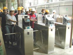 Macao construction workers, building a new casino, use hand geometry readers to enter the site.